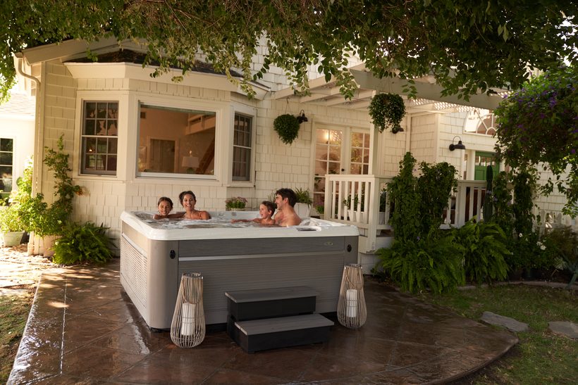 Caldera Paradise Series hot tub with family